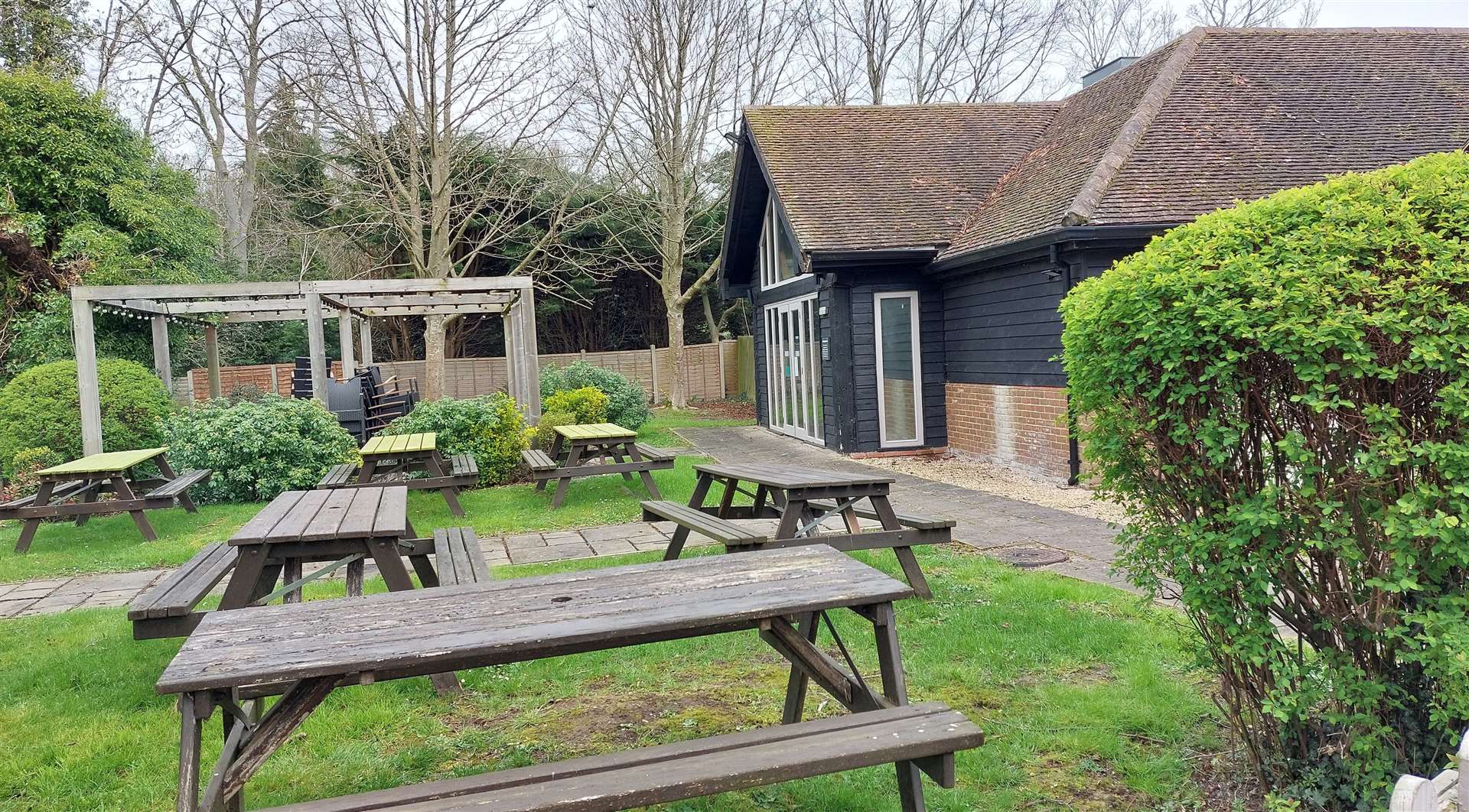 How the outdoor area currently looks; the pergola will be removed if the plans are approved