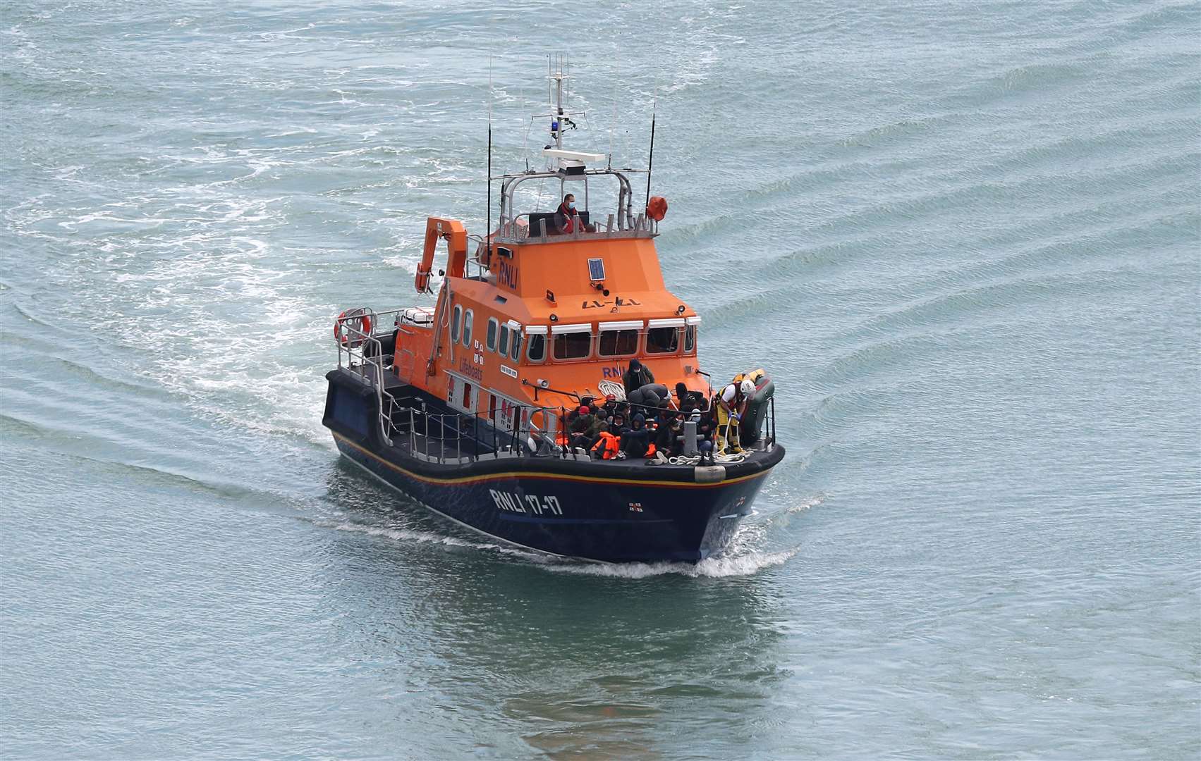 A group of people thought to be migrants are brought into Dover (Andrew Matthews/PA)