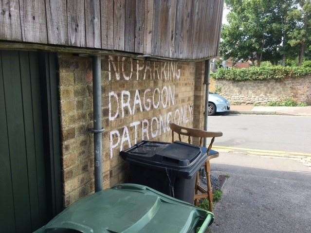 The sign couldn’t be clearer, parking is for pub patrons only – there’s space for three white vans