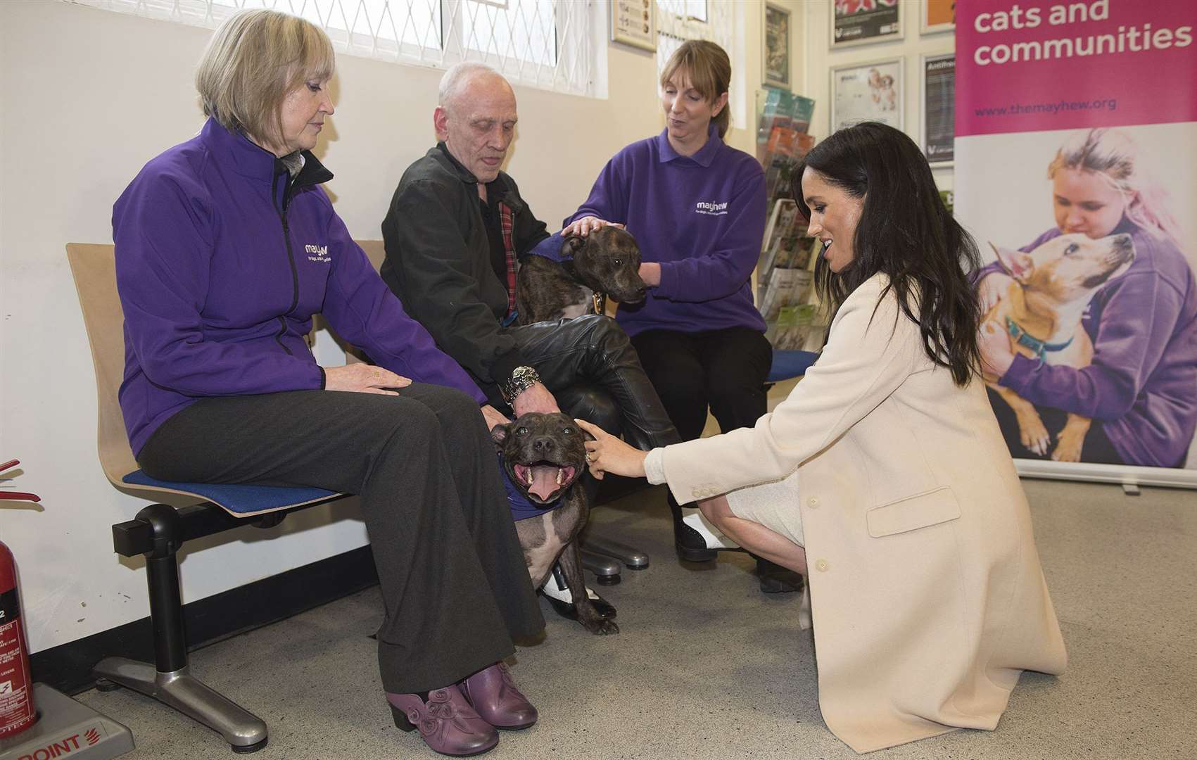 The duchess met Wully Struthers and his staffies Azzy and Gallis during her trip to the animal welfare charity (Eddie Mulholland/Daily Telegraph)