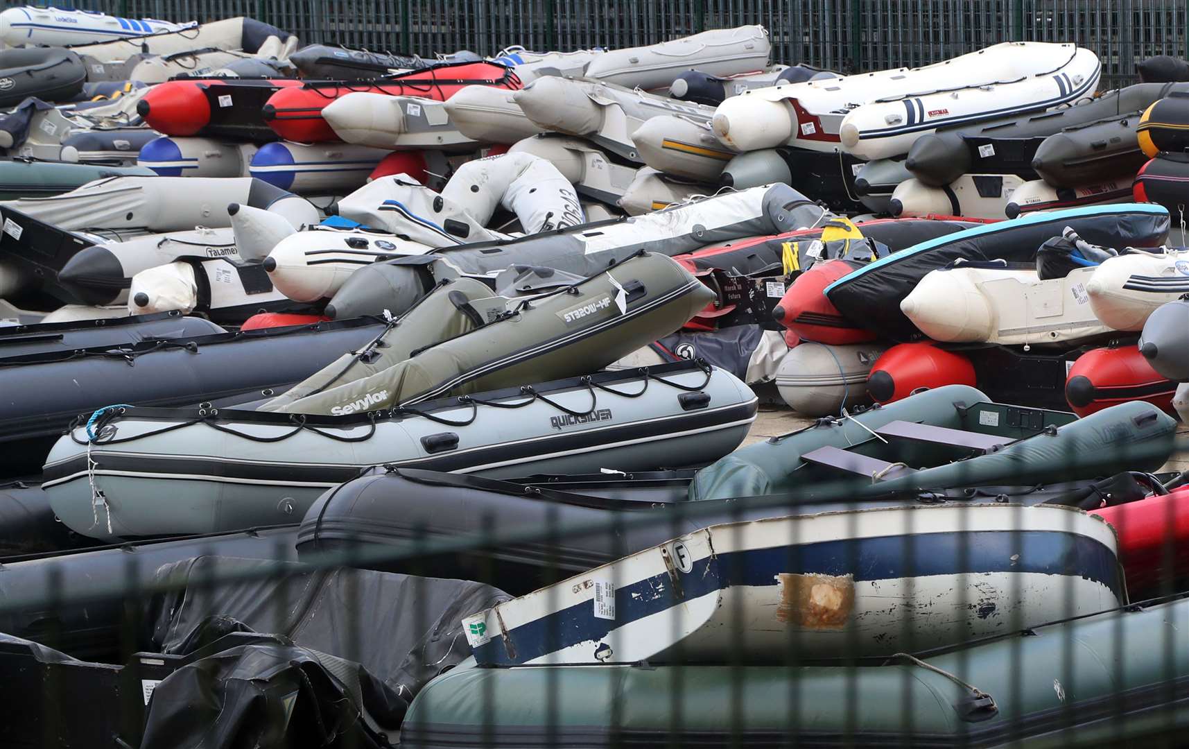 Boats in a secure compound in Dover which have been seized after being intercepted in the Channel (Gareth Fuller/PA)