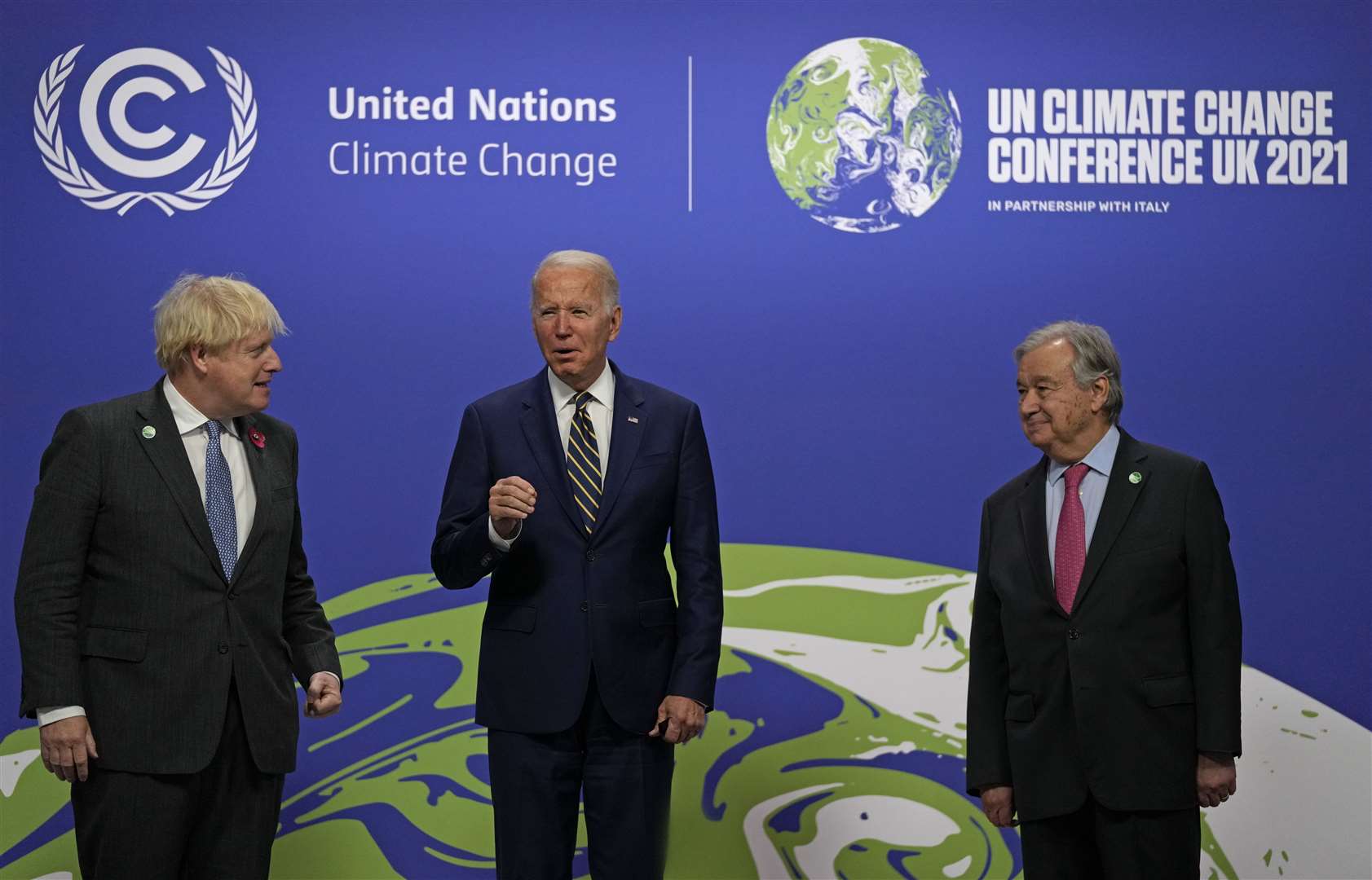 Boris Johnson and UN Secretary-General Antonio Guterres greet US pesident Joe Biden at the Cop26 summit (Alastair Grant/PA)