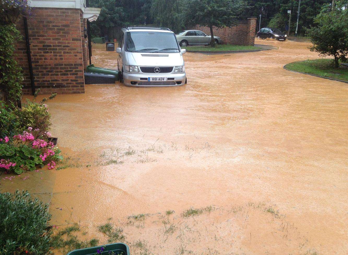 Paygate off Sutton Road was flooded after clay from Imperial Park development was washed down the hill during heavy rain on Sunday