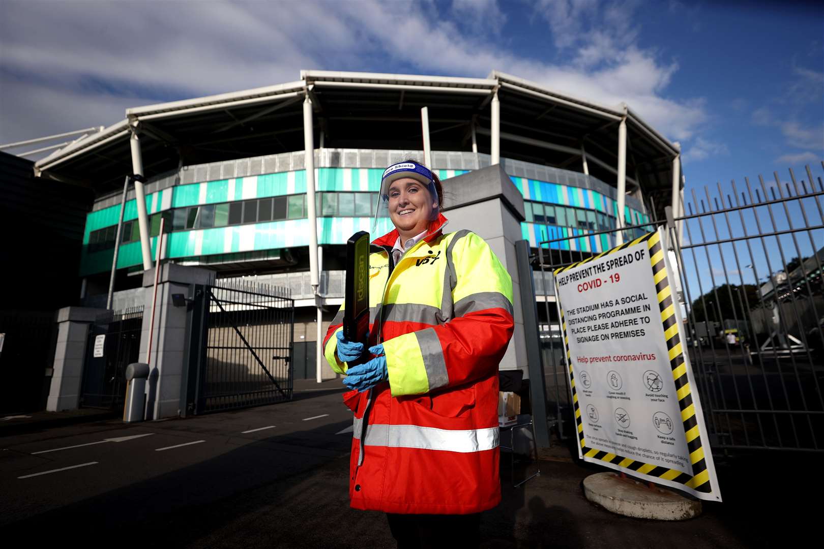 Security staff wearing PPE outside the stadium ahead of the Sadler’s Peaky Blinders Irish Cup Final match at Windsor Park, Belfast (Liam McBurney/PA)