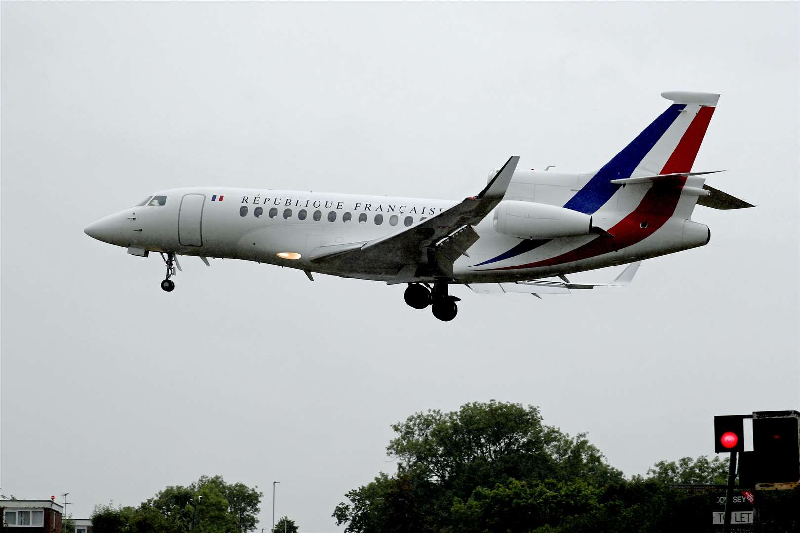 A plane carrying French President Emmanuel Macron lands at RAF Northolt (Steve Parsons/PA)