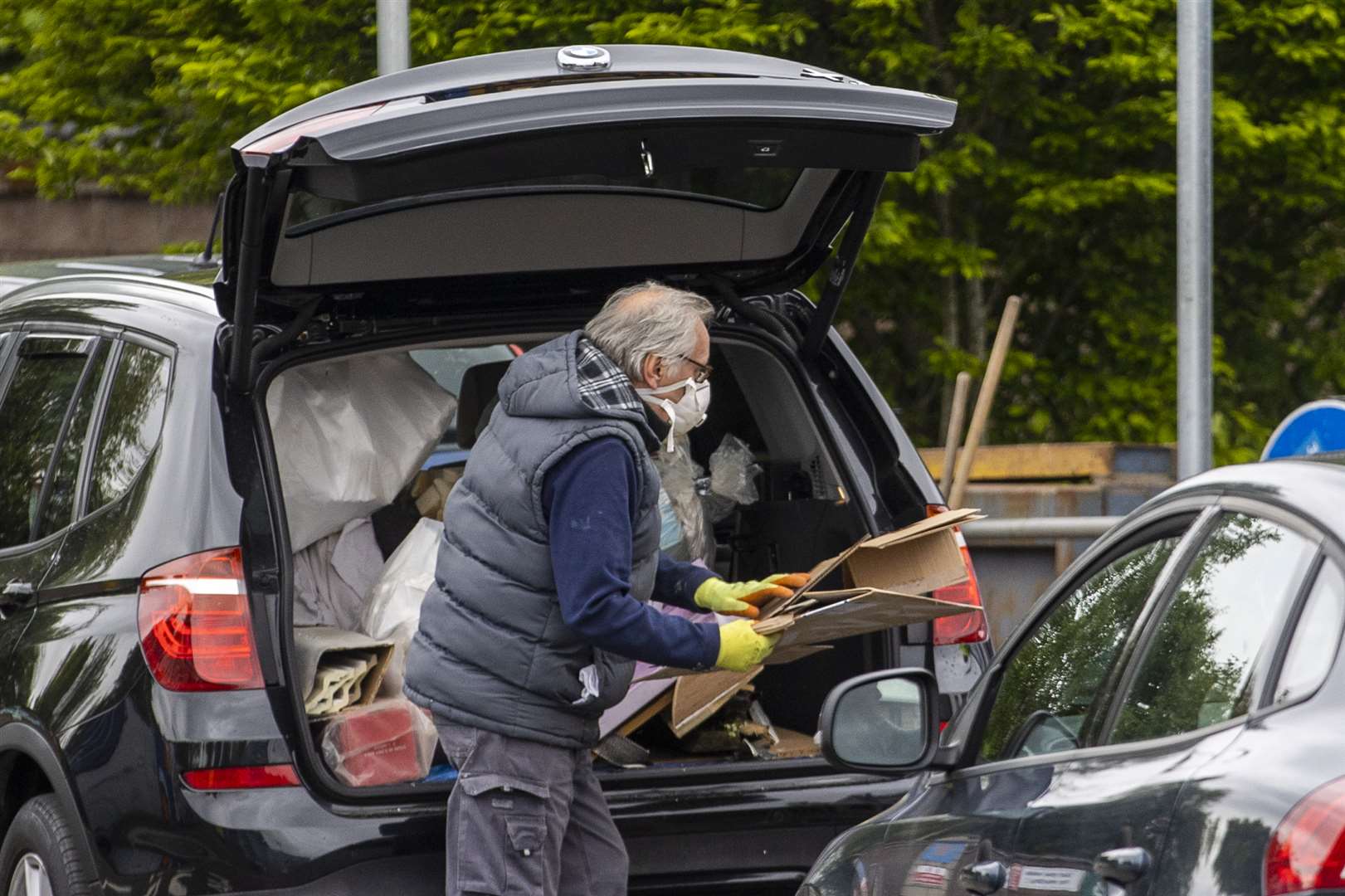 A man dropping off cardboard at Blackstaff Way Recycling Centre in west Belfast (Liam McBurney/PA)