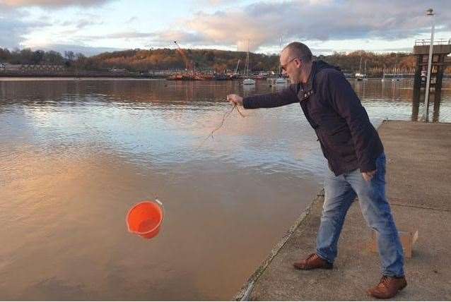 Collecting water samples in the Medway