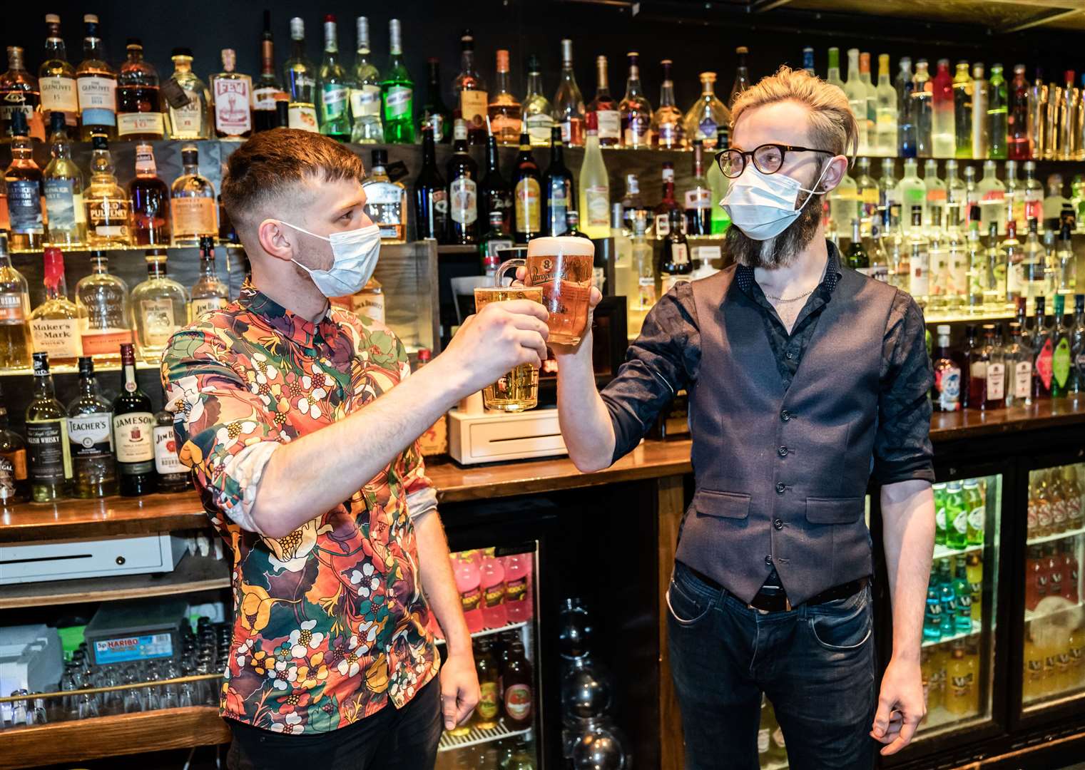 Bar staff celebrate in the Showtime Bar in Huddersfield, West Yorkshire, as indoor hospitality and entertainment venues reopen to the public (Danny Lawson/PA)