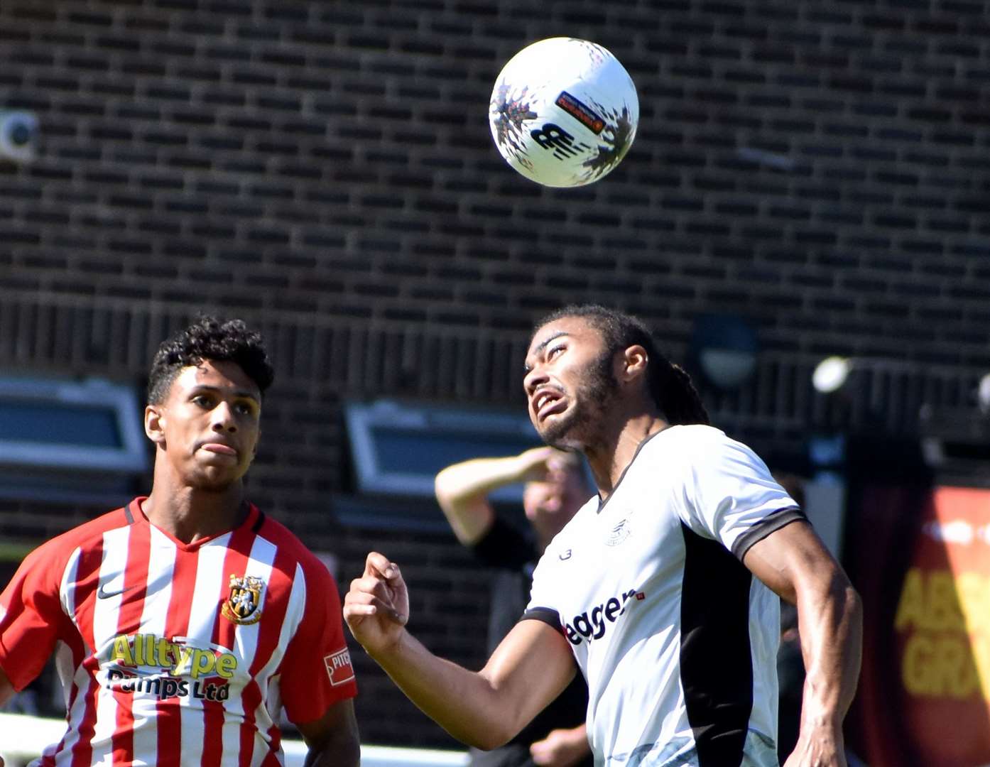 Jordan Ababio, of Folkestone, closes in on a Dover player in a friendly earlier this month. Picture: Randolph File