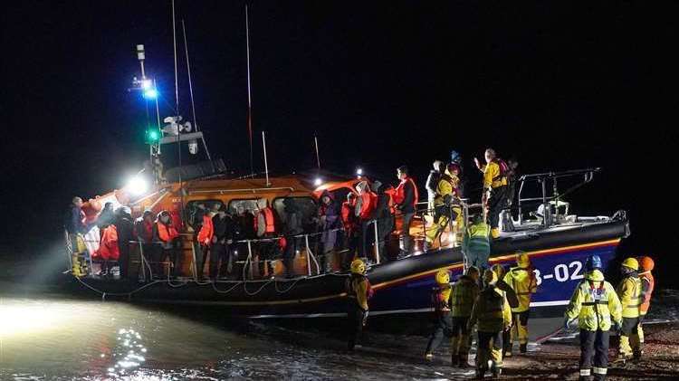 A group of people being helped by an RNLI lifeboat at Dungeness following a small boat incident in the Channel. Picture: Gareth Fuller/PA