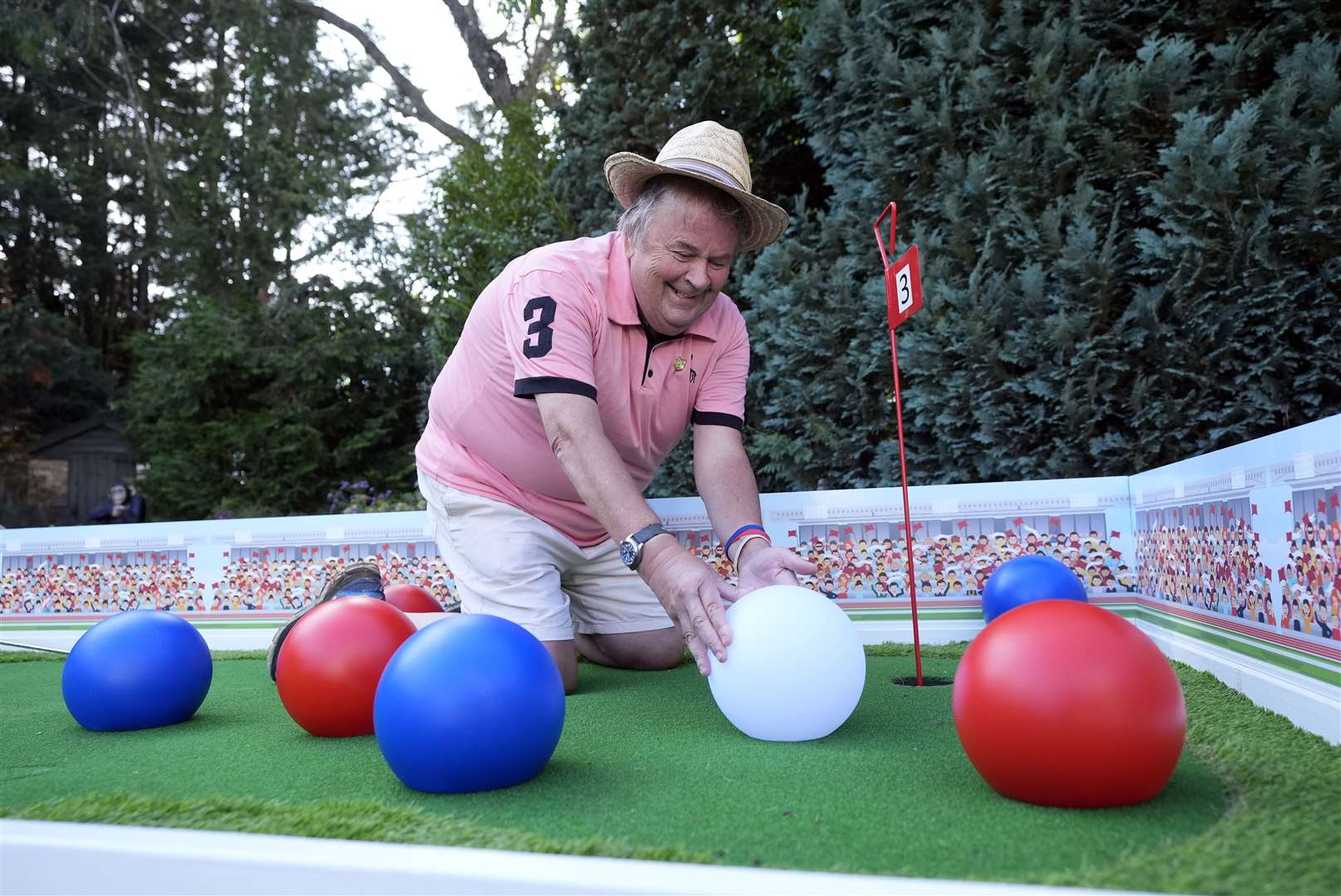 David Lawrence adjusting the layout of one of his holes which is themed around the Paralympic sport of boccia (Andrew Matthews/PA)