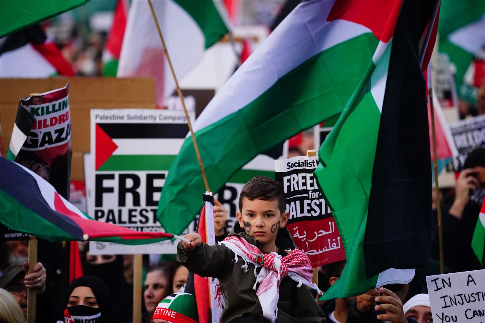 People at a rally in Trafalgar Square, London (Victoria Jones/PA)