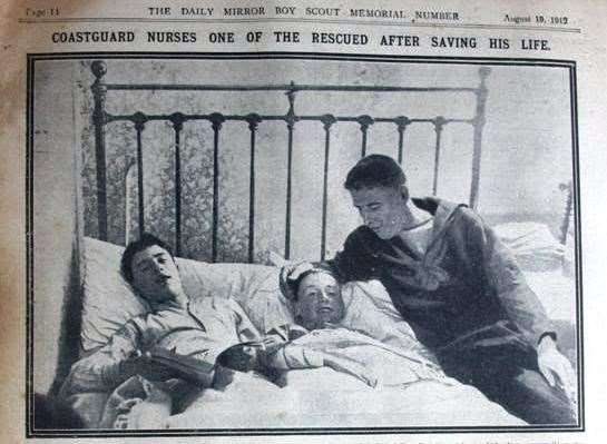 Newspaper picture of Sheppey coastguard Oliver Sharp visiting recovering Boy Scout Martin Schofield, who was rescued from the capsized Arethusa sailing ship which turned turtle off Leysdown in 1912, drowning nine young boys. Picture: Daily Mirror