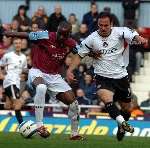 Radostin Kishishev battles for possession with West Ham's Nigel Reo-Coker. Picture: MATTHEW WALKER