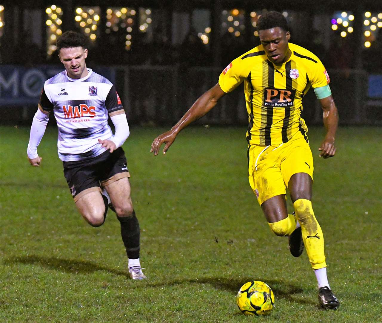 Stand-in Sheppey skipper Lekan Majoyegbe tries to move away from Deal substitute Wes Hennessey. Picture: Marc Richards