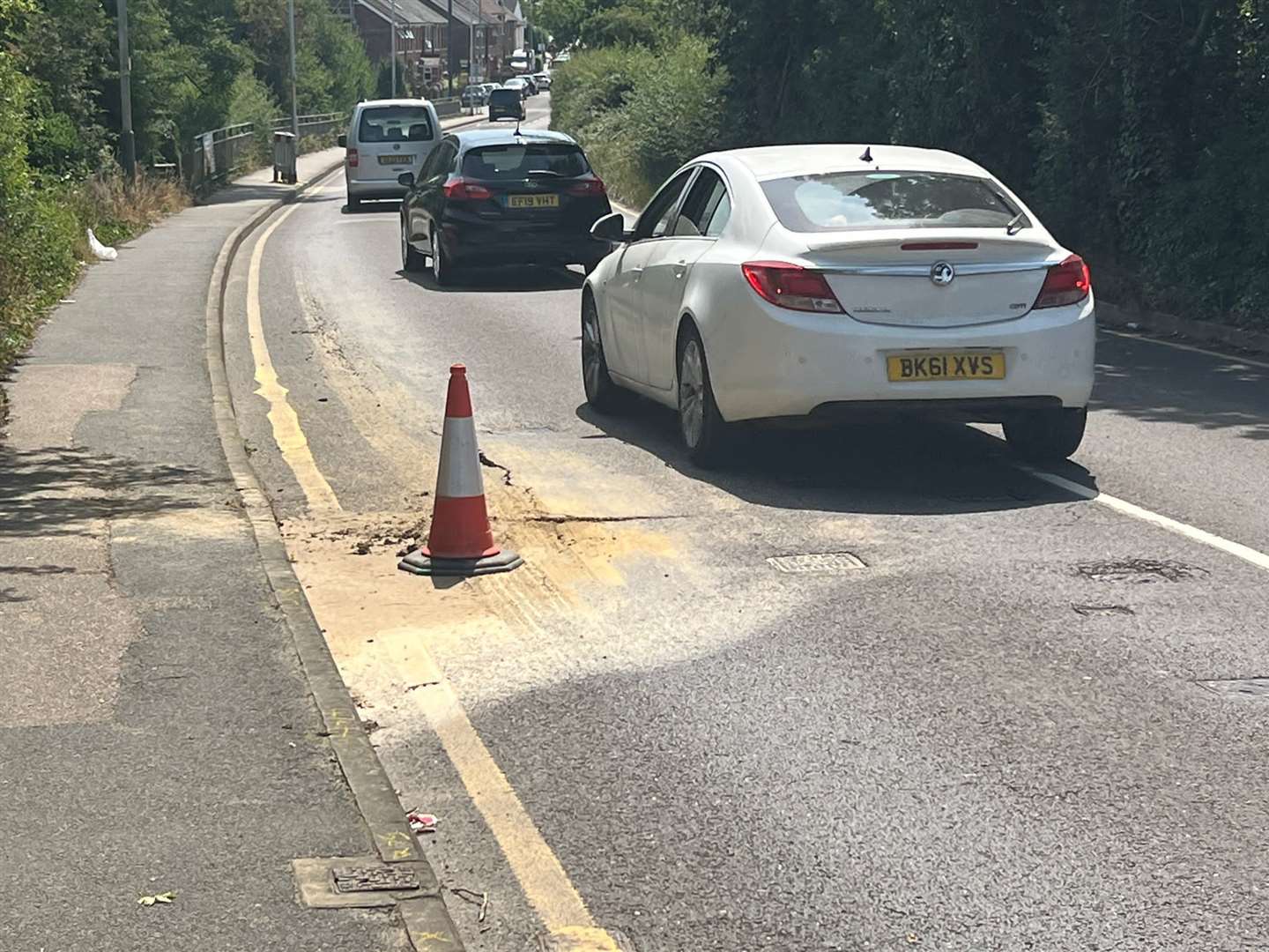 A water leak is causing the Maidstone Road (B2160) to crumble where it goes over the railway line in Paddock Wood. Picture: UKNIP