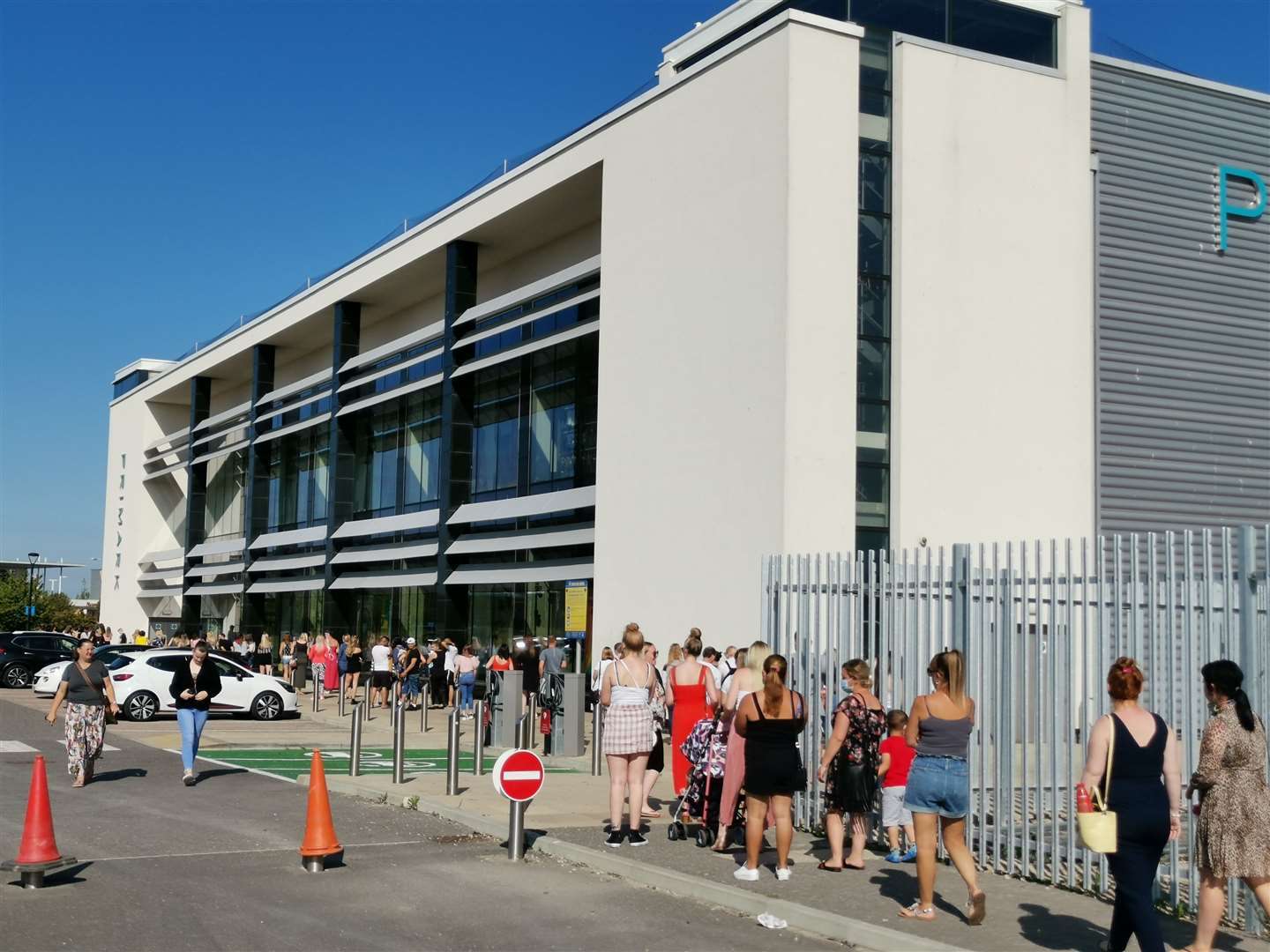 Shoppers welcome the re-opening of non-essential shops by queuing outside Primark at Westwood Cross