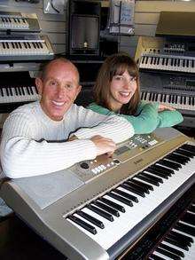 Lee McIntosh and Becky Dolby of County Music in Canterbury, who are donating a Yamaha keyboard for the county final of the KM Big Quiz.