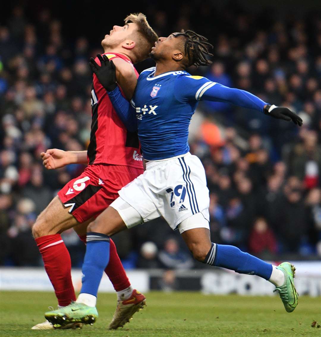 Gills' Jack Tucker and Ipswich's Kyle Edwards look up for the ball. Picture: Barry Goodwin