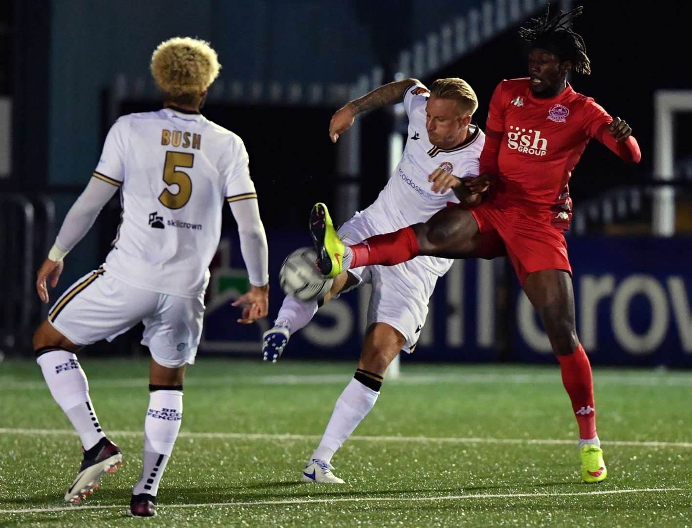 Bromley's Byron Webster clears under pressure from Dover forward Ade Azeez. Picture: Keith Gillard