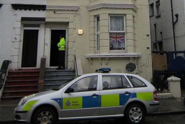Police standing guard at the house in Athelstan Road, Margate
