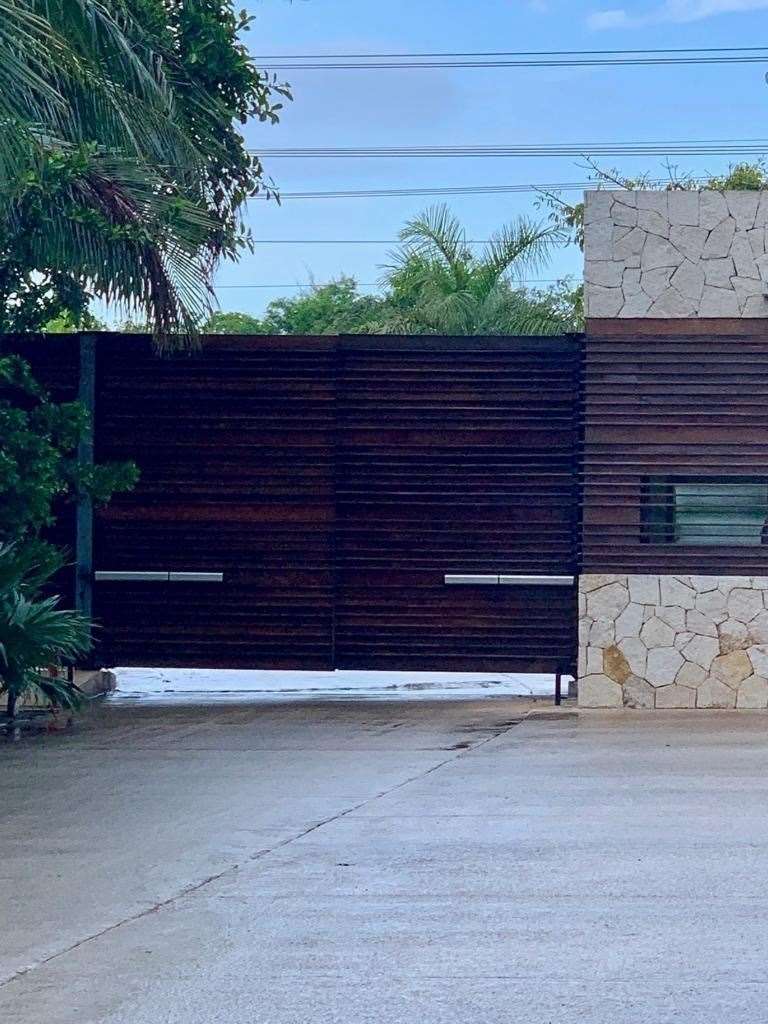 Two large gates were closed at the end of the hotel driveway (18223979)