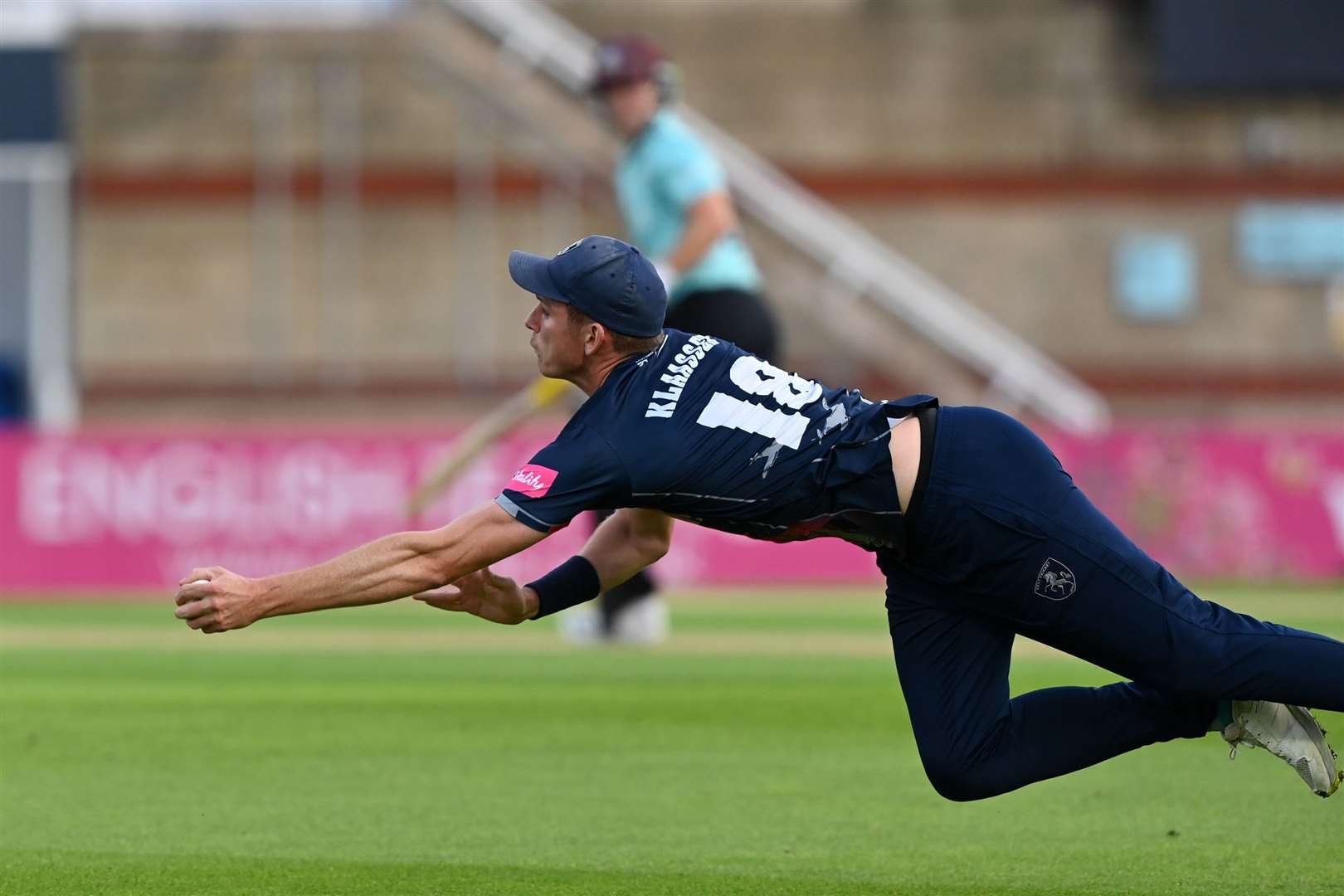 Kent's Fred Klaassen brilliantly catches Surrey's Rory Burns at short third man. Picture: Keith Gillard