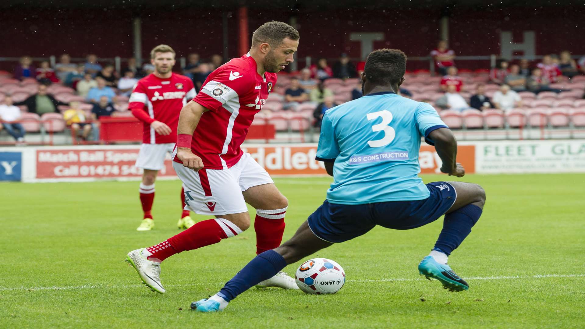 Robbie Willmott takes on former Fleet full-back Chris Sessegnon Picture: Andy Payton