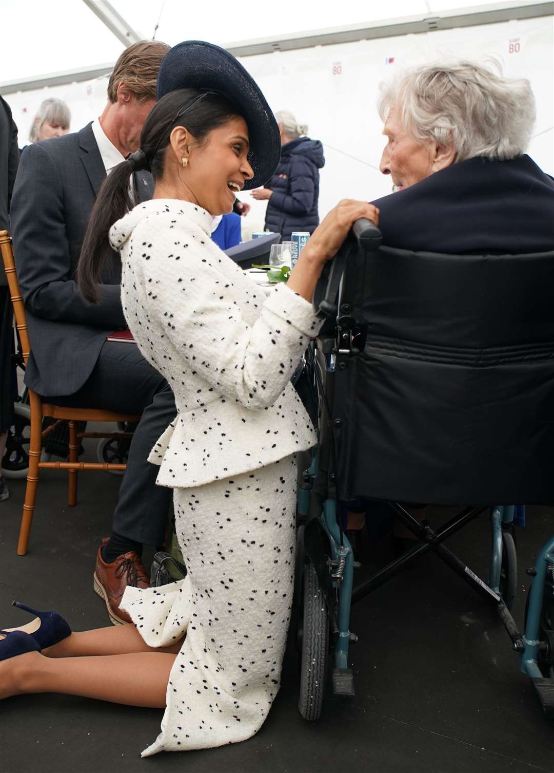 Prime Minister Rishi Sunak’s wife Akshata Murty speaks to D-Day veteran Christian Lamb, who was presented earlier with the Legion d’Honneur, during a lunch following the UK national commemorative event for the 80th anniversary of D-Day (Gareth Fuller/PA)