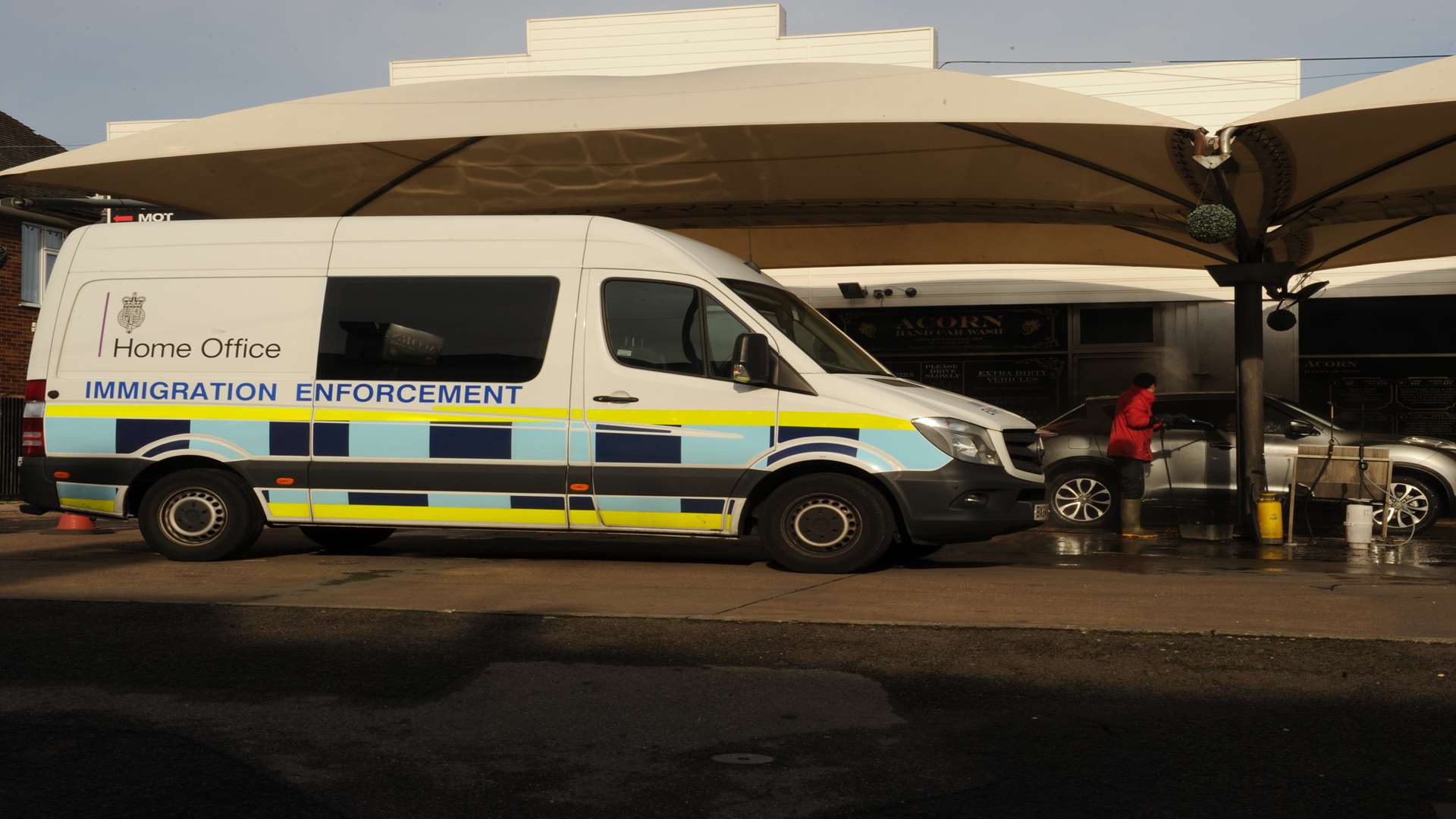 Immigration officials at the car wash