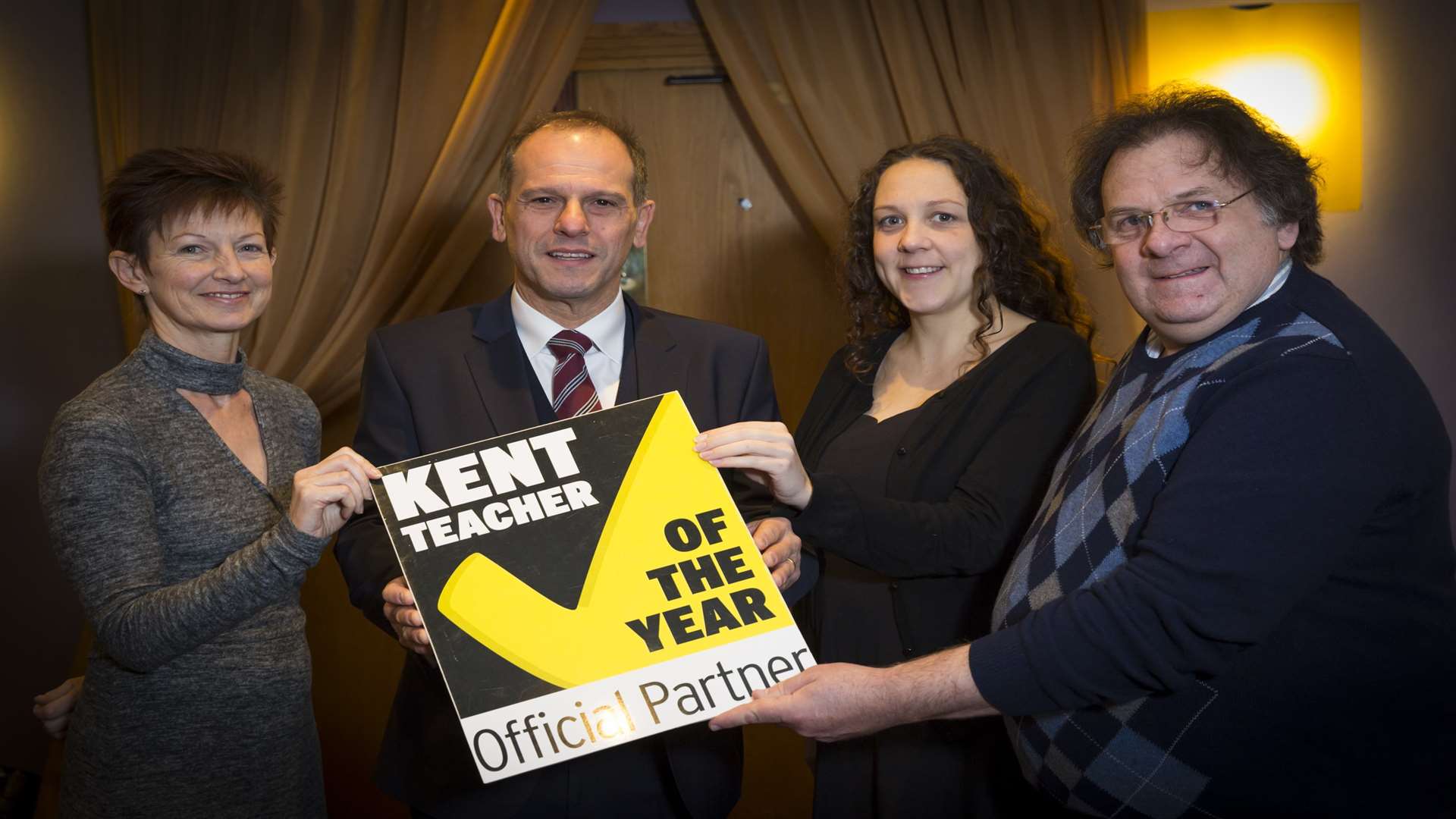 Joanne Winkler of Kent County Council, Dominic Di Cara of the Mercure Maidstone Great Danes Hotel, Catriona Jamieson of Medway Youth Trust, and Richard Langshaw of LoopCR demonstrate their support of the Kent Teacher of the Year Awards 2018.