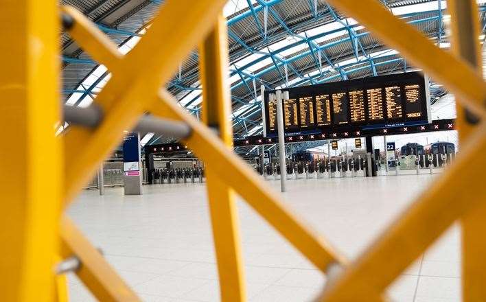 Barriers close off part of Waterloo train station in London during a previous strike by members of the Rail, Maritime and Transport union (James Manning/PA)