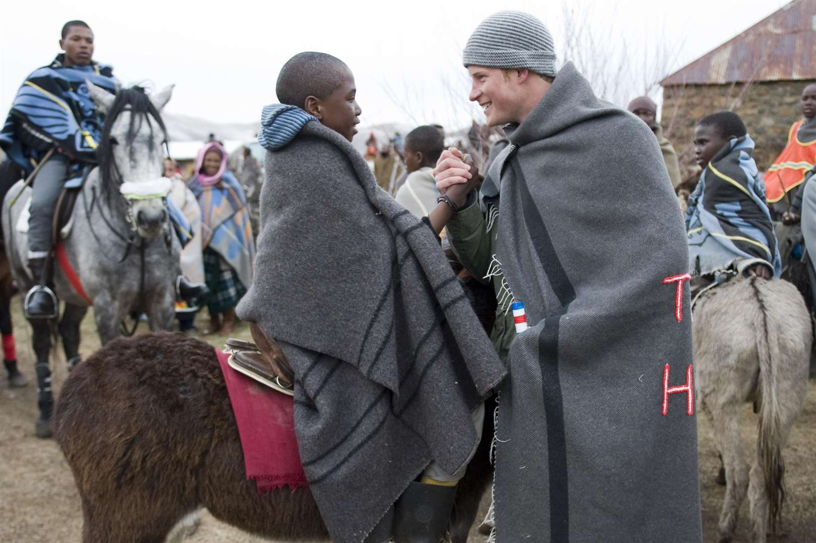 Harry dressed in a traditional Lesotho blanket (Arthur Edwards/The Sun/PA)