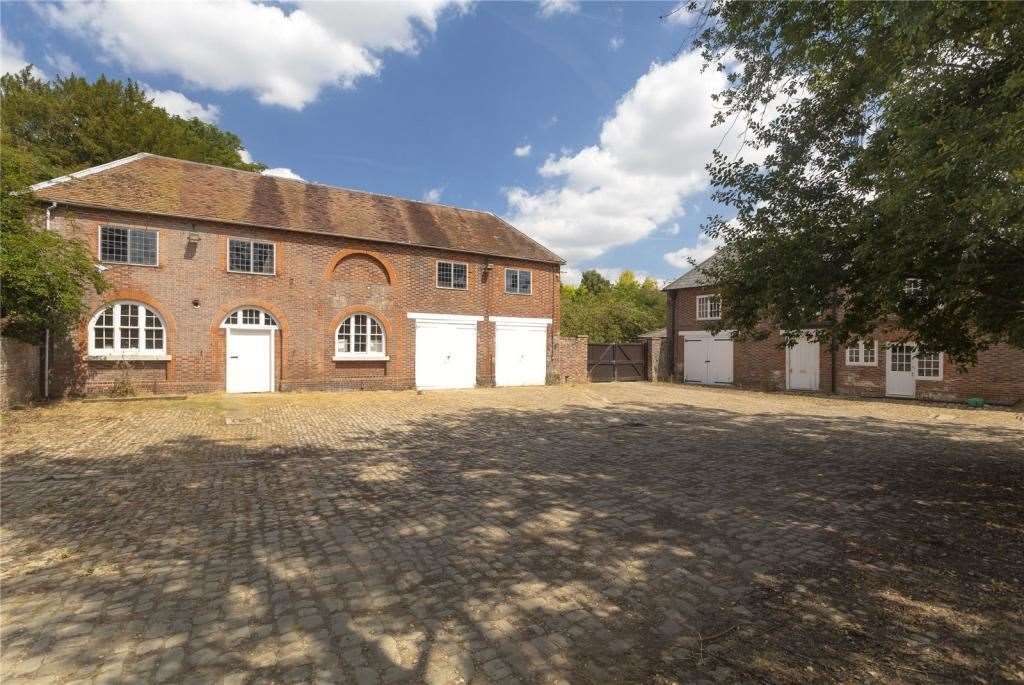 Cross the cobbled courtyard to the old Coach House. Picture: Strutt and Parker