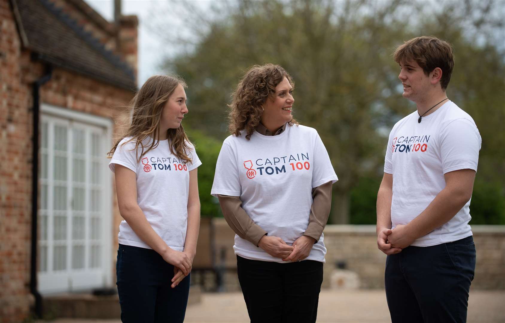 Captain Sir Tom Moore’s daughter Hannah Ingram-Moore and his grandchildren Georgia and Benjie are walking laps of their garden for the Captain Tom 100 challenge (Joe Giddens/PA)