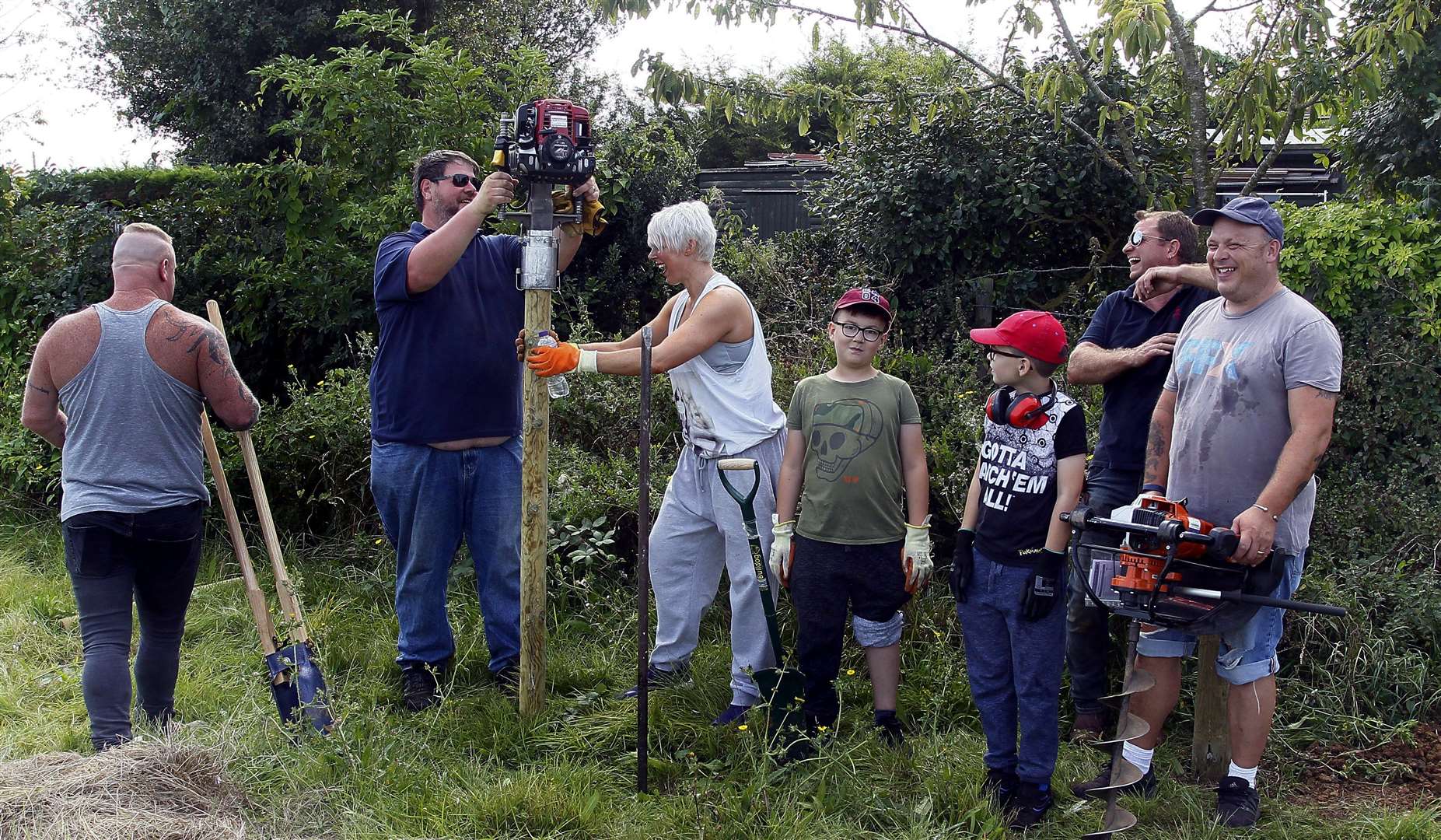 Curly's Farm, Leysdown, volunteers building a farm in a weekend get started with some fencing work in August 2019. Picture: Sean Aidan