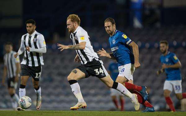 Gillingham’s Connor Ogilvie gets away from Brett Pitman Picture: Ady Kerry (3979534)