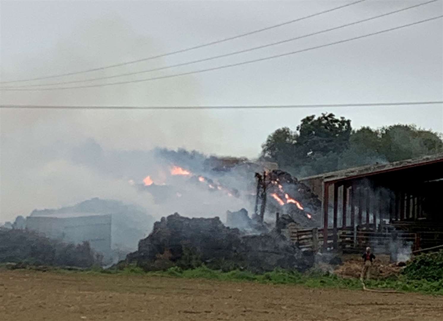 The fire at Elmtree Farm, Sellindge is still burning
