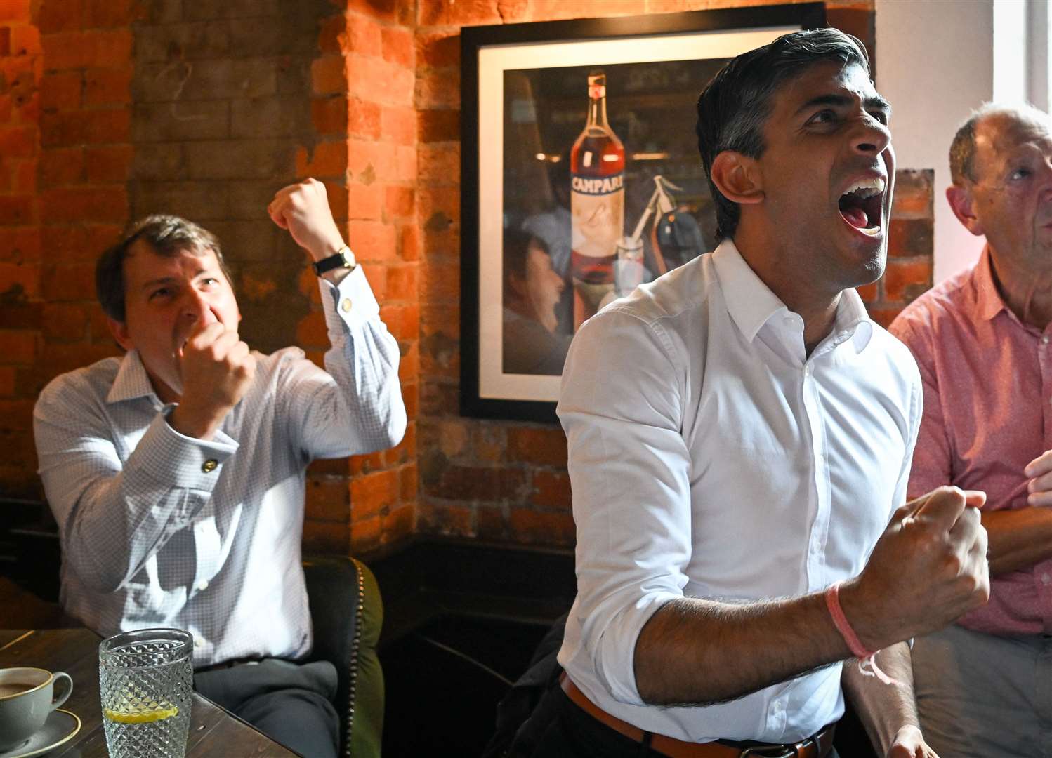 Rishi Sunak watched the Euro 2022 final at Bishops Mill pub in Salisbury with MP John Glen (Finnbarr Webster/PA)