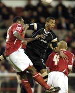 Marcus Bent battles for the ball in the air. Picture: MATT WALKER