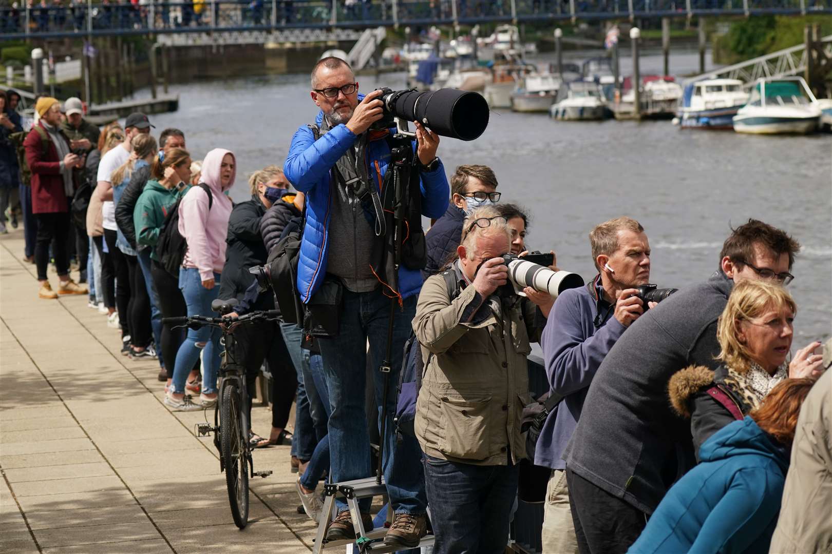 People gather on the footpath at Teddington Lock in the hope of spotting the whale (Yui Mok/PA)