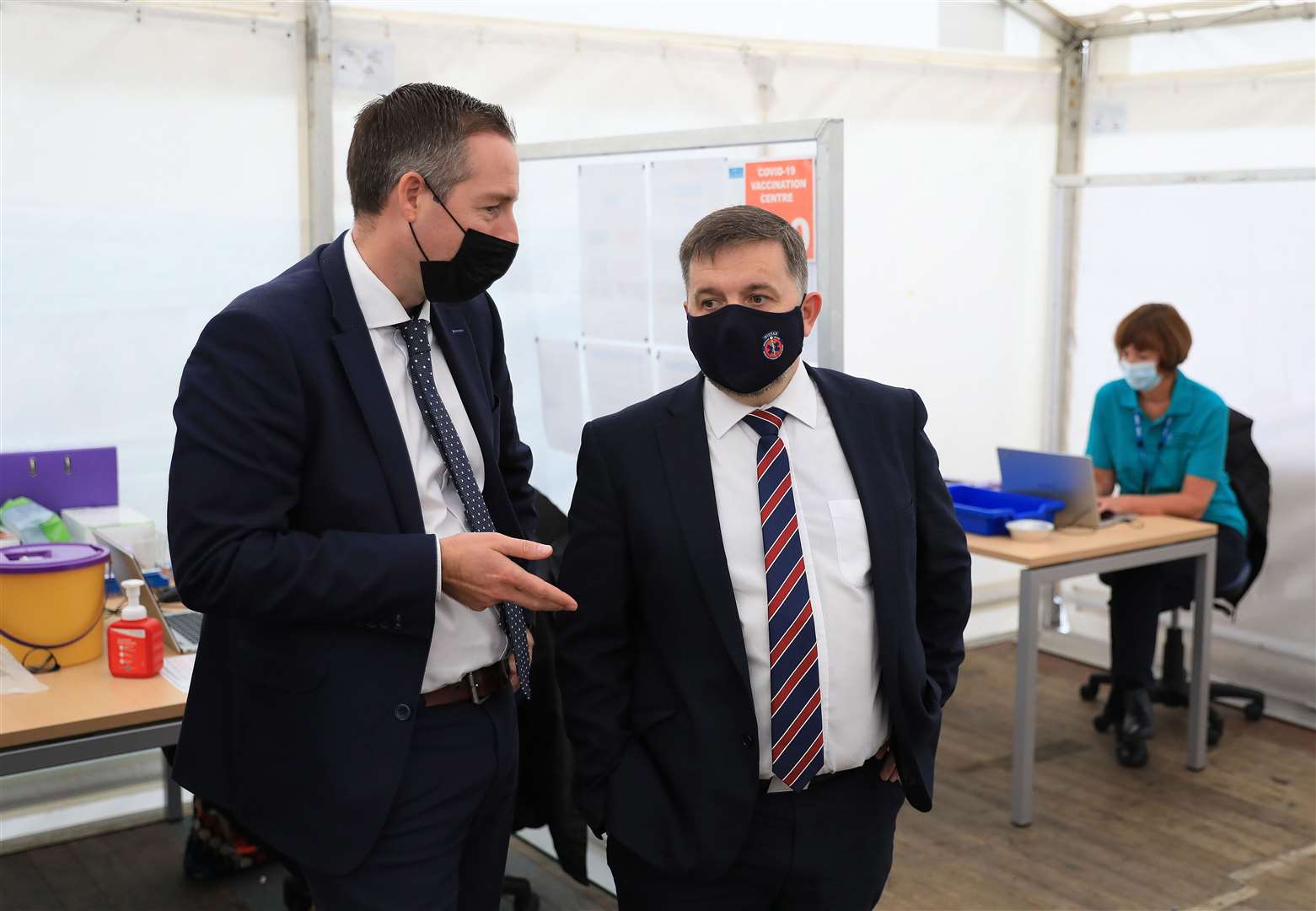 Northern Ireland First Minister Paul Givan (left) and Minister for Health Robin Swann visit a Covid-19 Vaccination centre at the Balmoral show, Lisburn (Peter Morrison/PA)