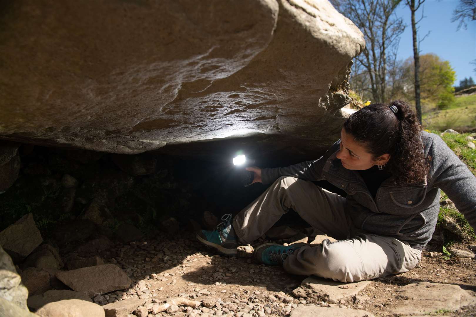 Joana Valdez-Tullett, post-doctoral research assistant on Scotland’s Rock Art Project, looking at prehistoric carvings found at Kilmartin Glen (Santiago Arribas Pena/HES)