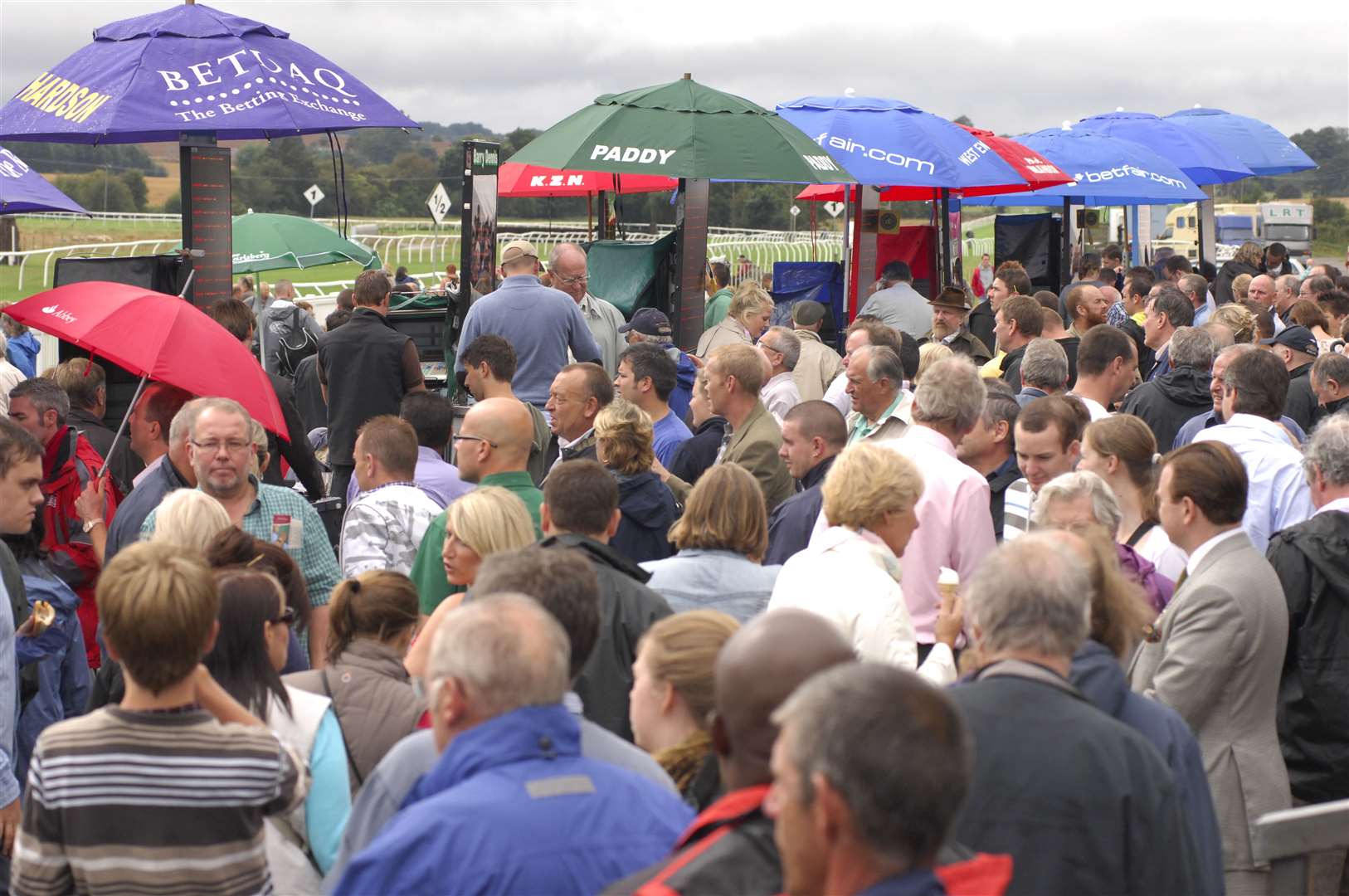 Place your bets now... a big crowd at the KM family fun day meeting in August 2010