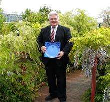 Bob Young (54) who works for Merit Solutions at the Kent Science Park given a crystal plate in recognition of his services as a blood donor.