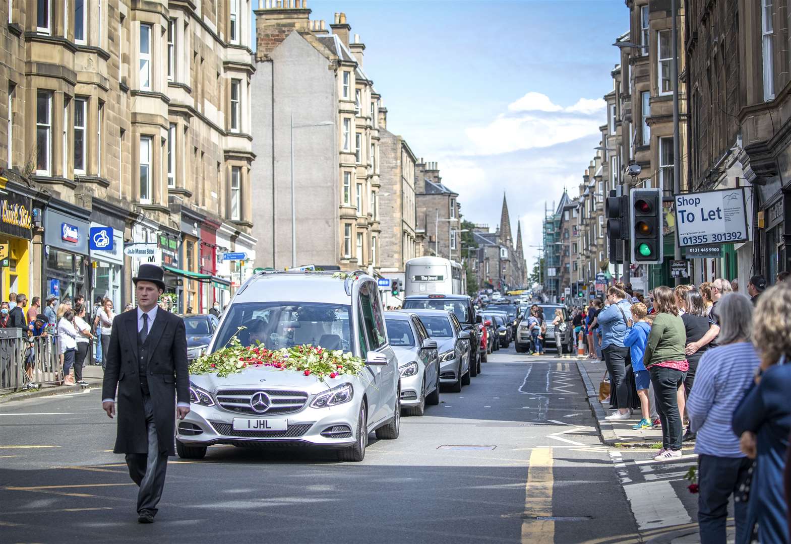 The route of the funeral cortege was lined by local people (Jane Barlow/PA)