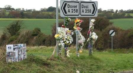 Floral tributes and a personal montage of David Wilson's photographs and mementoes have been placed at the scene. Picture: TERRY SCOTT