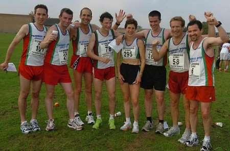 The men's and women's winners Paul Hasler and Tina Oldershaw (centre) with the first runners of the Paddock Wood team back during the Kent 10-mile road race