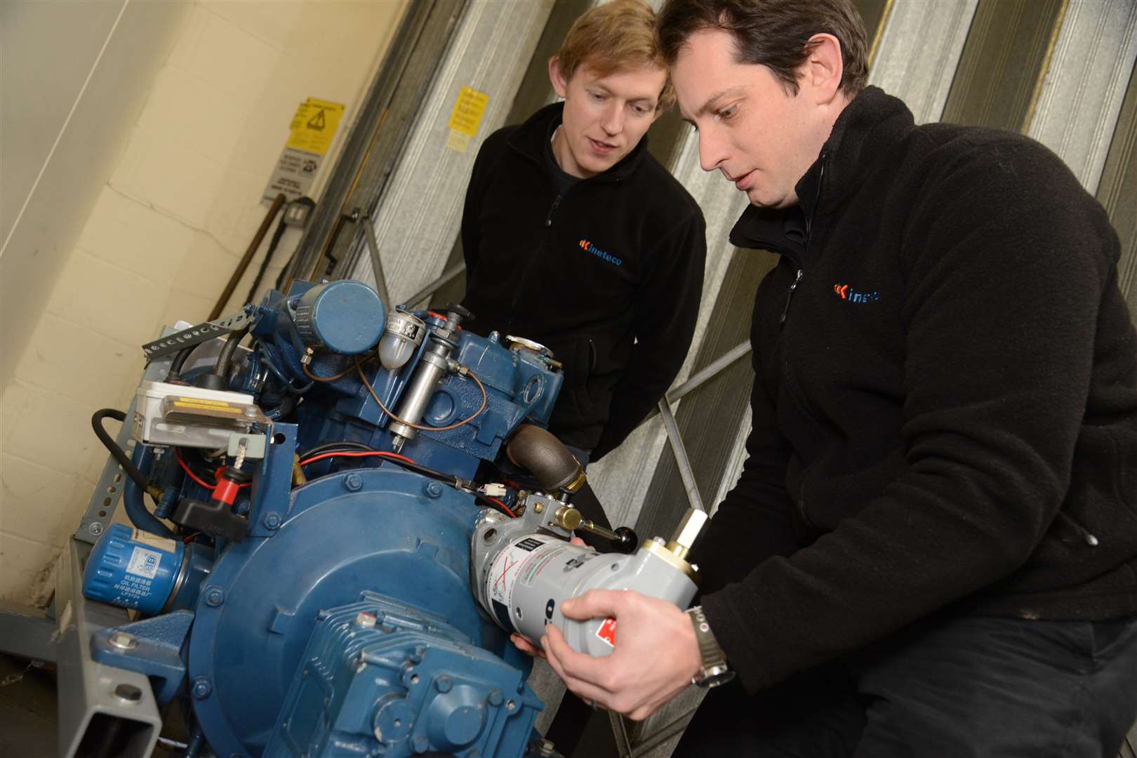 Design engineer Phil Lenney and senior technical manager Max Sheppard testing one of the starters on an engine. Picture: Gary Browne