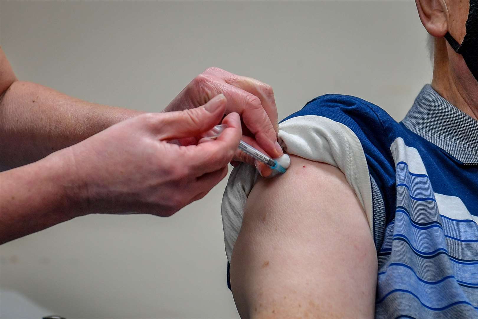 A man receives a Covid-19 vaccine (Ben Birchall/PA)